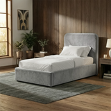 [Single | Light Grey] Wider angle of Pluva velvet bed in styled bedroom showing surrounding furniture and flooring