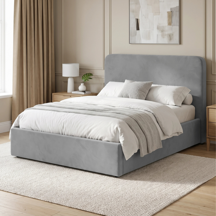 [Double | Light Grey] Angled bedroom view with rounded headboard, white bedding, curtain, bedside table and rug
