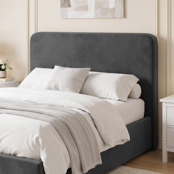 [Double | Grey] Close-up of rounded headboard behind white pillows, textured cushion, folded throw and side tables