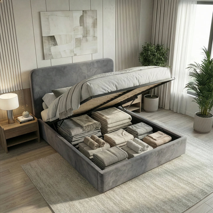 [Small Double | Grey] Pluva ottoman bed made up in grey velvet with folded throw and pillows along headboard