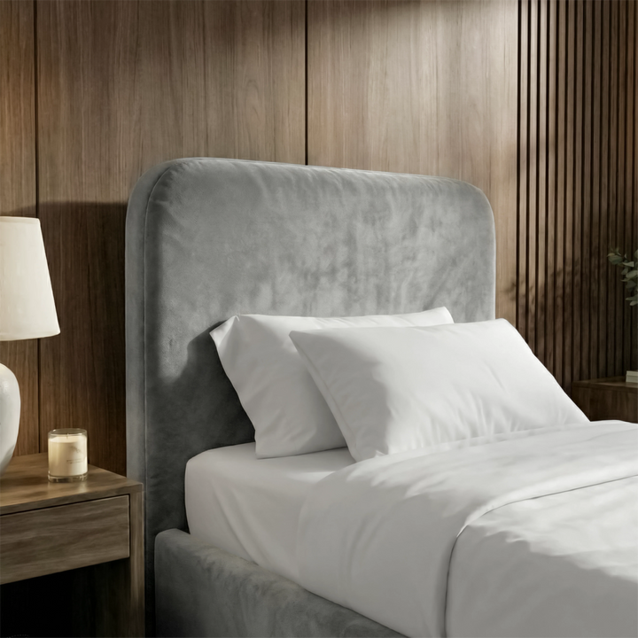 [Single | Light Grey] Close-up of Pluva ottoman storage bed headboard in light grey velvet with two white pillows