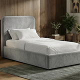 [Single | Light Grey] Pluva velvet ottoman storage bed single against slatted wood wall with white bedding and framed art