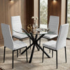 [White | Set of 4] PU leather dining chairs set around a glass table in a bright dining room