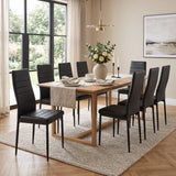 [Black | Set of 8] PU leather dining chairs set around a wooden dining table in a bright dining room