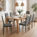 [Grey | Set of 8] PU leather dining chairs set around a wooden dining table in a bright dining room