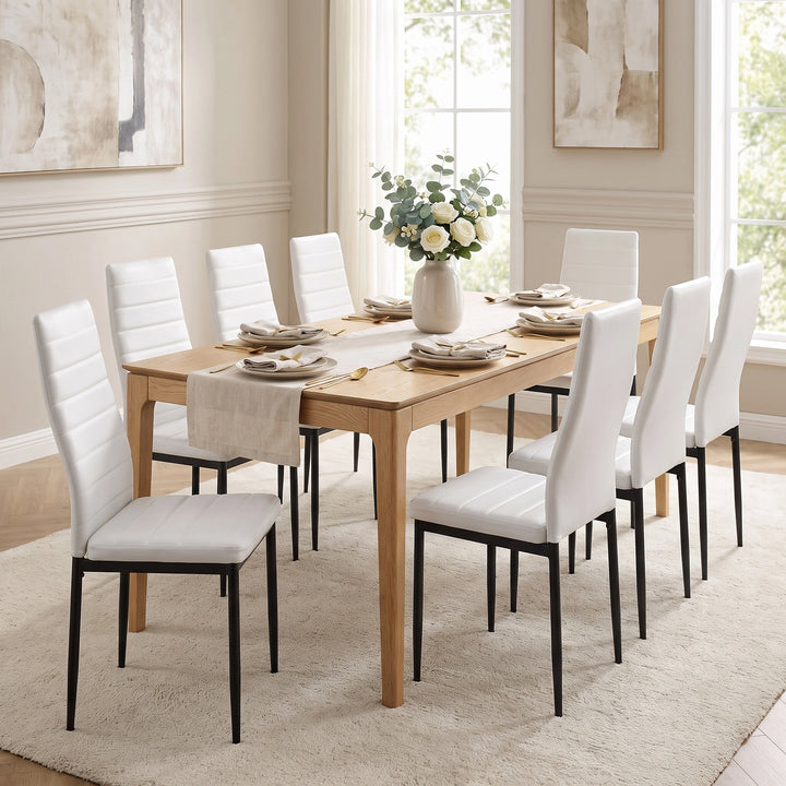 [White | Set of 8] PU leather dining chairs set around a dining table in a bright dining room
