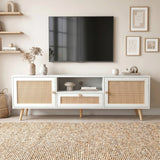 [White] Wovena Rattan TV Unit 160cm shown straight-on with ceramic vases, dried flowers, and gallery wall art above a wall-mounted television