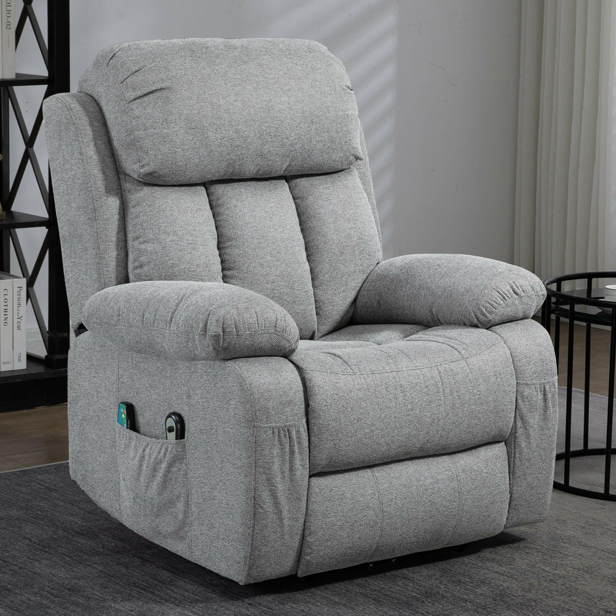 Recliner chair with massage and heat in grey fabric, featuring side storage pockets.