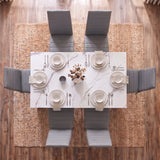 [6 Seater | Grey] Overhead view of a modern dining set featuring a rectangular white marble-patterned table surrounded by six gray upholstered chairs, set on a woven jute rug over a wood floor.