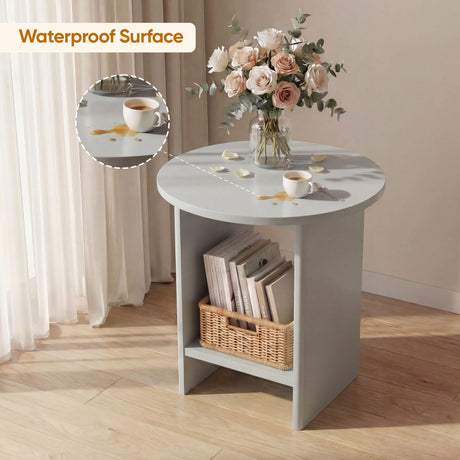 [Grey] Waterproof surface detail of grey round end table holding cream roses above books and wicker basket