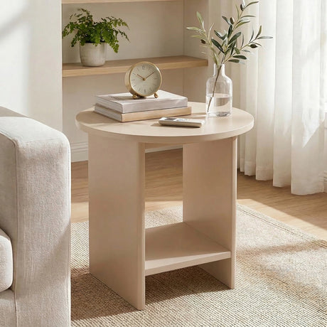 [Taupe] Living room scene with taupe round end table, olive branch vase on shelf behind, armchair at left