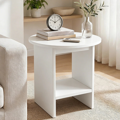 [White] White round side table with shelf angled beside cream boucle armchair, books and table clock on top