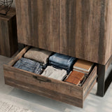 [Rust Wood] Rustvale drawer detail showing folded jeans, jumper, books, journal, metal runners, and lower handle.
