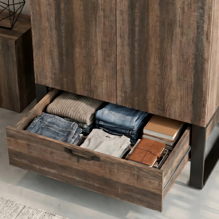 [Rust Wood] Rustvale drawer detail showing folded jeans, jumper, books, journal, metal runners, and lower handle.