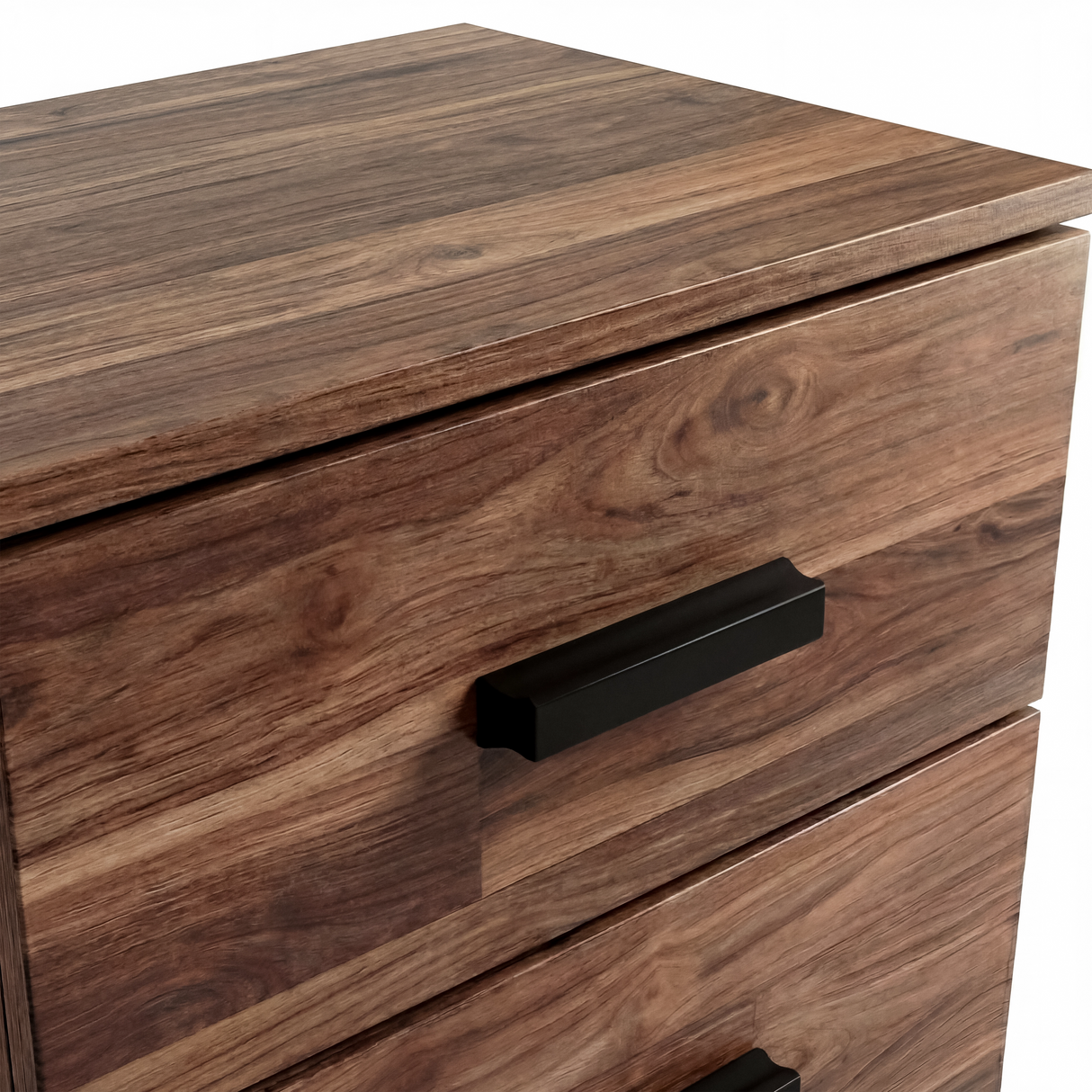 Close up of black wooden handle mounted on textured drawer front panel of the rustic bedside cabinet