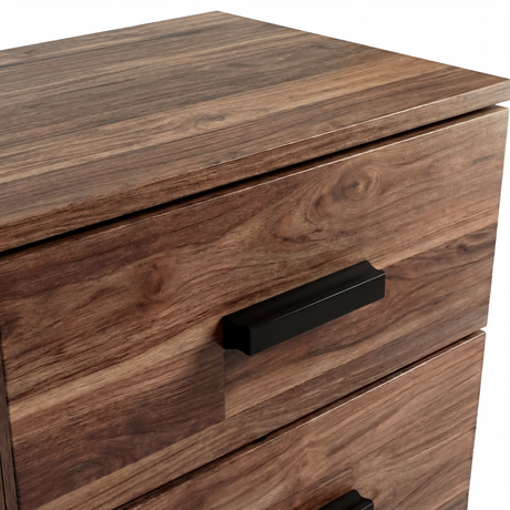 Close up of black wooden handle mounted on textured drawer front panel of the rustic bedside cabinet