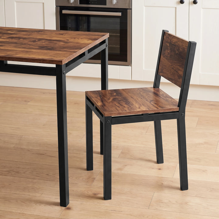 [Rustic] Breakfast table and chair close-up view with rustic panels, black metal frames, open support rails and visible bolts