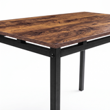 [Rustic] Close-up view of wood-effect tabletop, black powder-coated metal frame, raised supports, square legs and corner bolt