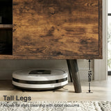 [Rustic] Larvik TV unit close-up of left cabinet door distressed-grain front beside tapered black leg with flooring below