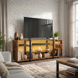[Rustic Brown] Industrial LED TV Stand with Storage against a white brick wall with warm amber LED underlighting, open shelves holding a soundbar, candles, baskets and vinyl records