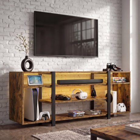 [Rustic Brown] Zelumi TV cabinet angled view in a brick-wall room with warm yellow LED shelves, consoles, VR headset, and vase on top surface