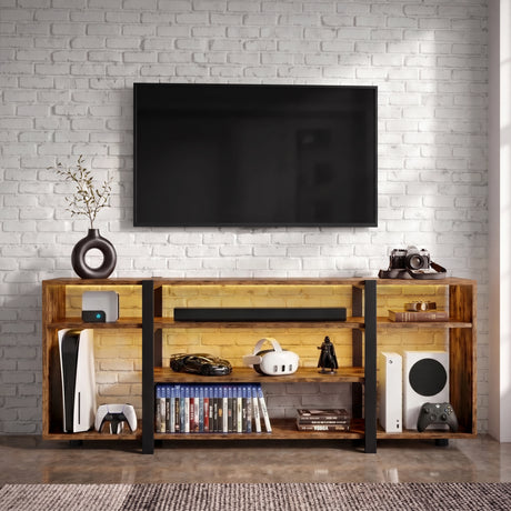 [Rustic Brown] Zelumi TV cabinet front-facing in a brick-wall room with warm LED shelves, consoles, game cases, soundbar, and decorative items on top