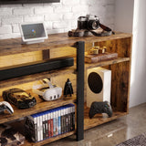 [Rustic Brown] Zelumi TV cabinet right-side close-up with warm LED-lit shelves holding console, VR headset, soundbar, game cases, and collectibles