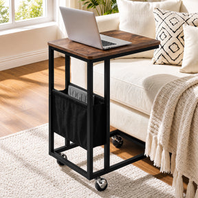 [Rustic] C-shaped side table by sofa with rustic wood-effect top, black frame, pouch, laptop and caster wheels