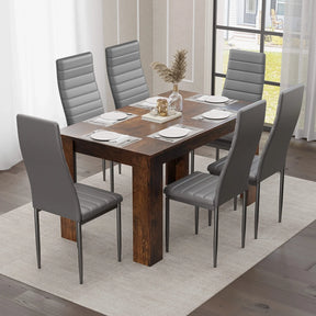 Rustic 4-6 seater dining table set with grey PU leather chairs in a bright dining space. Perfect for UK family homes.