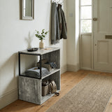 [Rustic Grey] This narrow side table stands in a hallway with a plant, folded textiles and accessories on its open shelves.