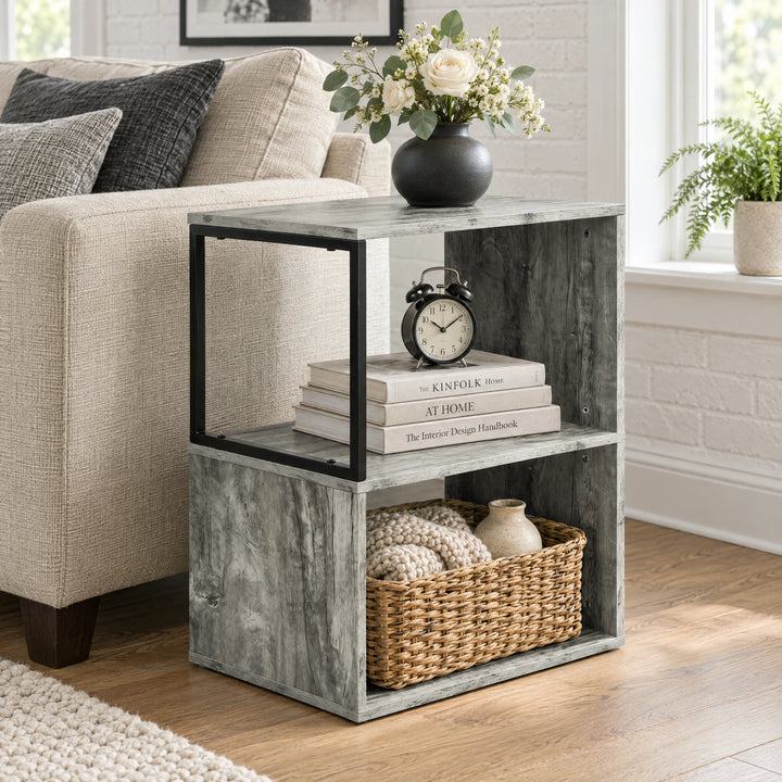[Rustic Grey] This narrow side table stands beside a sofa with flowers, books and a basket across its open shelves.