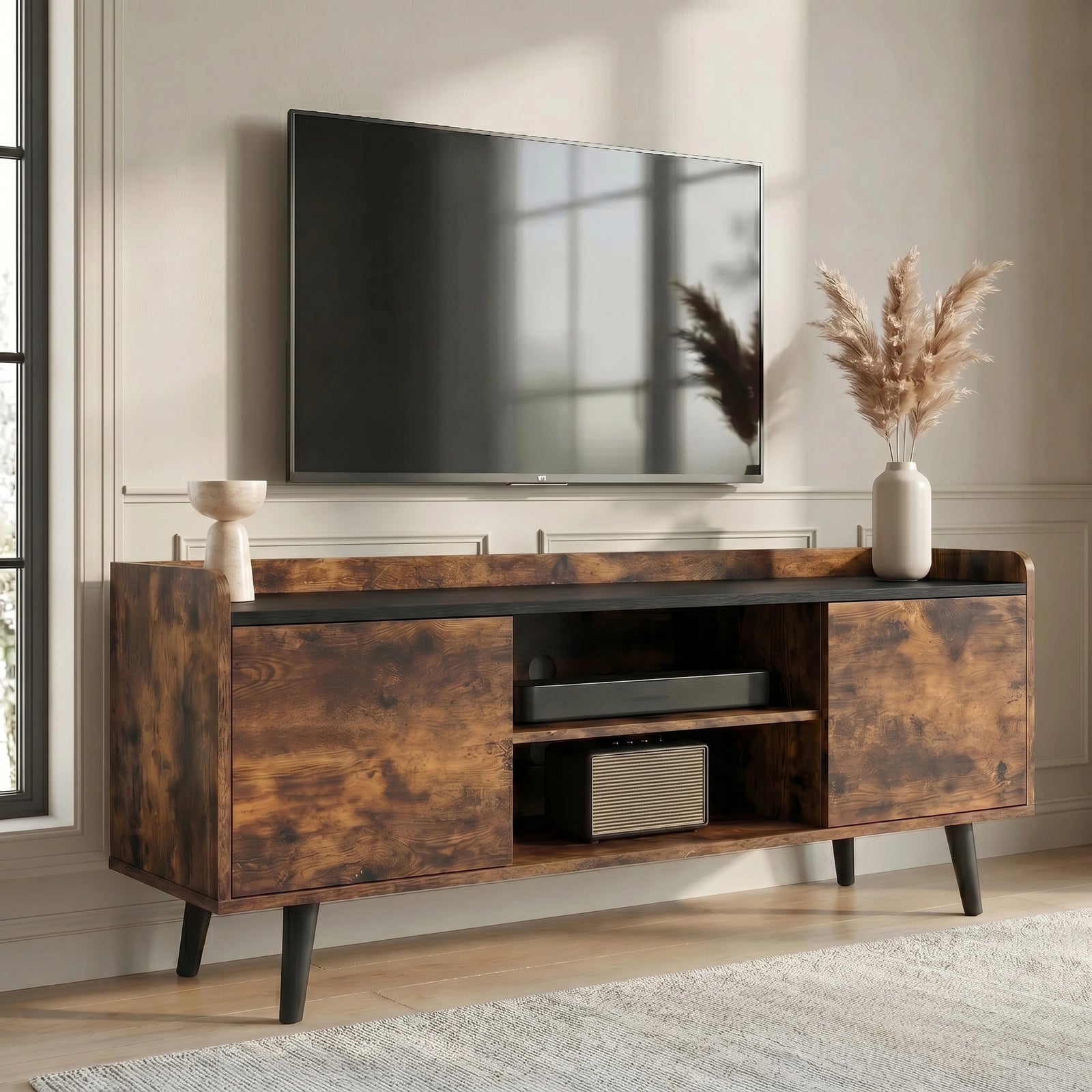 [Rustic | 112 cm] Larvik Rustic TV Unit with Storage 112cm Black Top styled in neutral living room with two cabinet doors, open centre shelves and tapered black legs