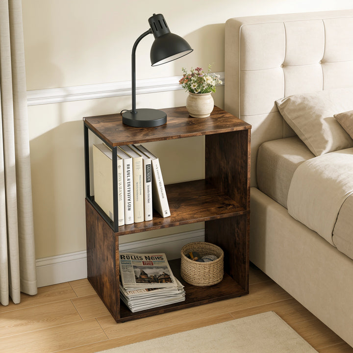 [Rustic] This narrow side table stands beside a bed with a lamp, books and a basket on its open shelves.
