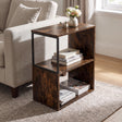 [Rustic] This narrow side table stands beside a sofa with flowers, books and magazines on its open shelves.