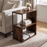 [Rustic] This narrow side table stands beside a sofa with flowers, books and magazines on its open shelves.