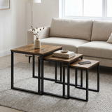 [Rustic] Stackora nest of tables set of 3 arranged in a living room with sofa, rug, and decorative items styled across all three surfaces