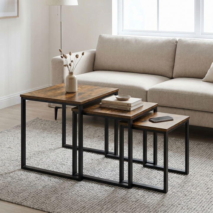 [Rustic] Stackora nest of tables set of 3 arranged in a living room with sofa, rug, and decorative items styled across all three surfaces