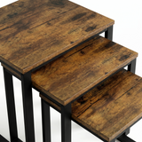 [Rustic] Stackora set of 3 nest of tables top-down close-up showing rich rustic wood grain texture and dark knot detailing on all three surfaces