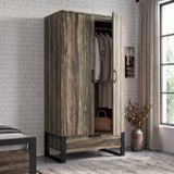 [Rustic Dark Wood] wardrobe with black metal legs, shown open in a styled bedroom setting with clothes hanging inside.