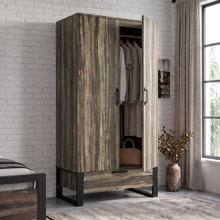 [Rustic Dark Wood] wardrobe with black metal legs, shown open in a styled bedroom setting with clothes hanging inside.