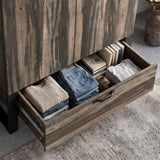 [Rustic] Rustvale drawer detail showing folded jeans, jumper, books, journal, metal runners, and lower handle.