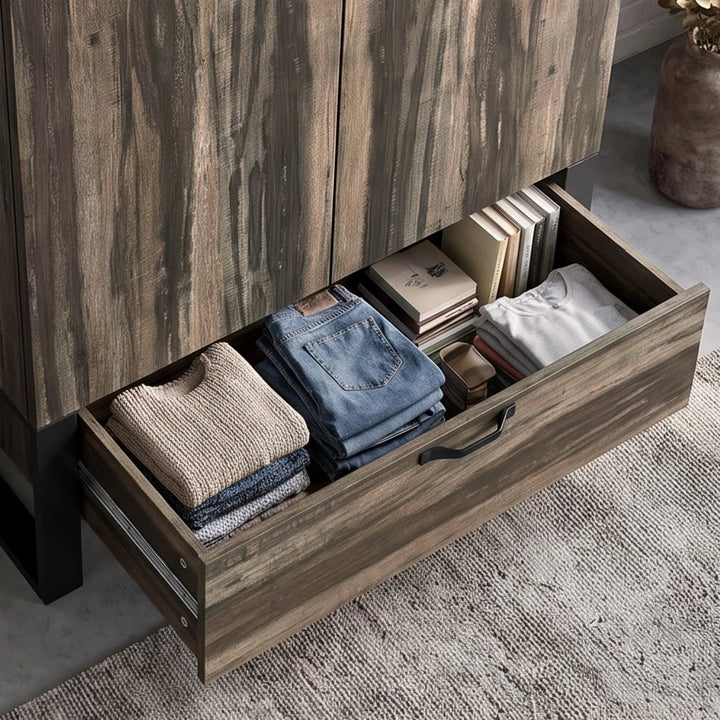 [Rustic Dark Wood]  Rustvale drawer detail showing folded jeans, jumper, books, journal, metal runners, and lower handle.