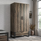 [Rustic Dark Wood] Rustvale wardrobe in bedroom with closed doors, lower drawer, black metal legs, pendant light, bed, and plant.