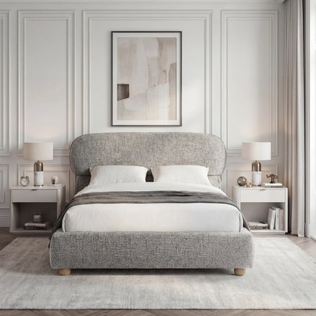 [King | Grey] Front view of upholstered bed with pill-shaped headboard centred between matching nightstands with lamps