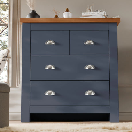 [Blue] Shaker chest of drawers in navy blue with vase decor on the oak top and panelled wall behind