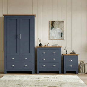 [Blue] Shaker blue wardrobe, 4 drawer chest and 2 drawer bedside grouped on shaggy rug with oak tops