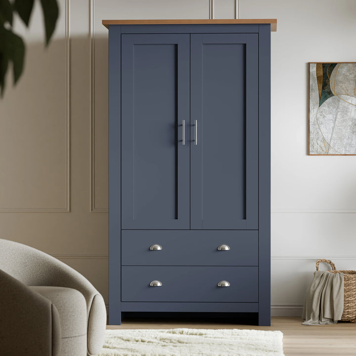 [Blue] Front view of navy blue wardrobe in Shaker style, central chrome bar handles between the doors