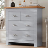 [Grey] Shaker chest of drawers in grey angled beside window, oak top styled with ornaments, cup handle pulls