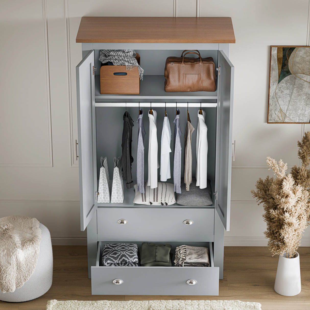 high angle shot of an open grey shaker double wardrobe with drawers showing clothes hanging on the rail and folded in drawers
