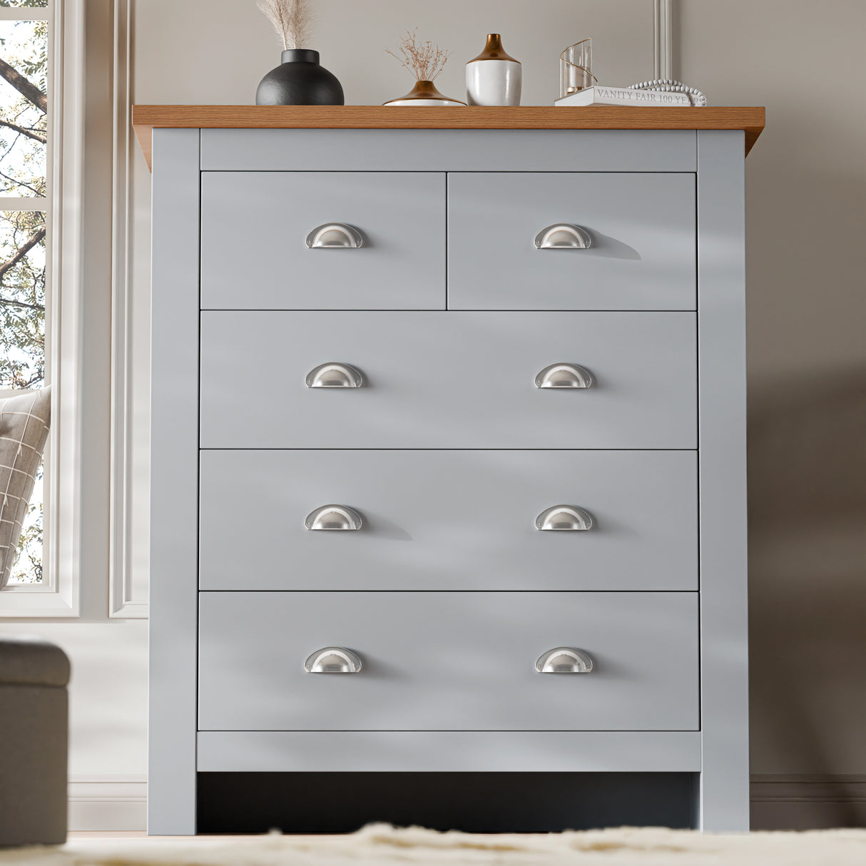 Grey 5 Drawer Chest of Drawers with shaker design and silver handles, offering elegant bedroom storage solution.